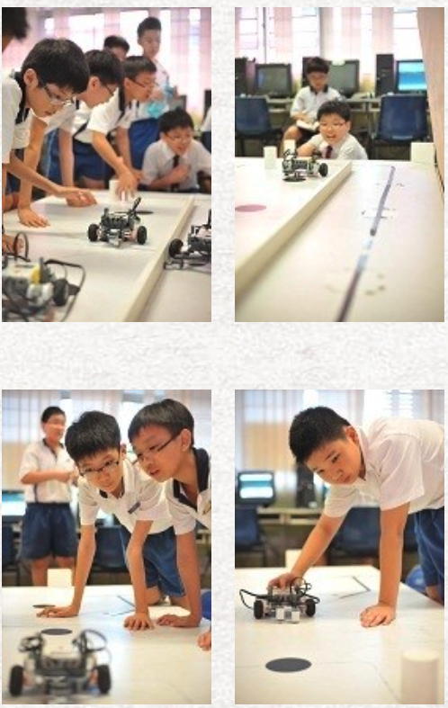 Four photos of school children in uniforms leaning over tables, closely observing small wheeled robots.